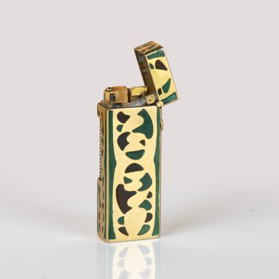 a close up of a lighter on a table with a white background