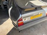 a car that is parked in a garage with its roof down