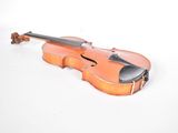 a violin that is sitting on a white surface