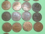 a lot of coins that are on a green surface
