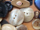 a lot of buttons that are on a table