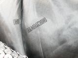 a close up of a bag with buttons on it