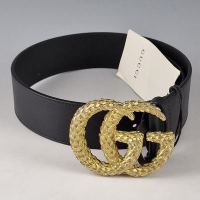 black leather belt with a gold buckle and a black belt with a gold buckle