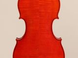 a red violin with a wooden back and bow on a white background