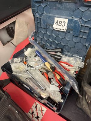 many tools in a tool box on a table