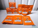 five packets of coffee sit on top of a table next to a bag of coffee