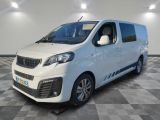 the white van is parked on a checkered floor in a room