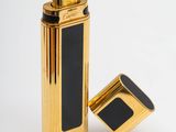 a close up of a lighter on a white surface