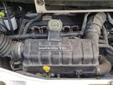 a picture of a car ' s engine with its hood open