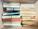 a box full of books sitting on top of each other
