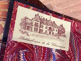 a red book with a picture of a castle on it