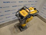 an image of a yellow and black machine in a room