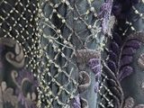an image of a close up of a purple and black dress