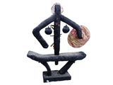 a sculpture of a man with a hat on a bench