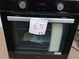 a black oven sitting on top of a cardboard box