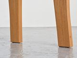 a close up view of the legs of a wooden table