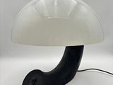 an image of a black and white lamp with a white shade