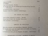 an open book with a list of items on it sitting on a table