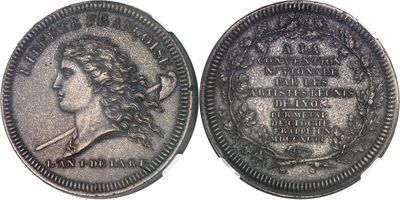 a close up of a coin on a white surface
