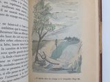 an open book with a picture of a boat on it