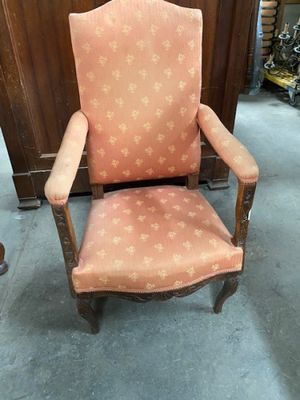 an old chair with a pink upholstered upholstered upholstered upholstered upholstered