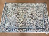 a close up of a rug on a wooden floor