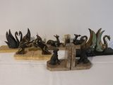a lot of figurines that are sitting on a table
