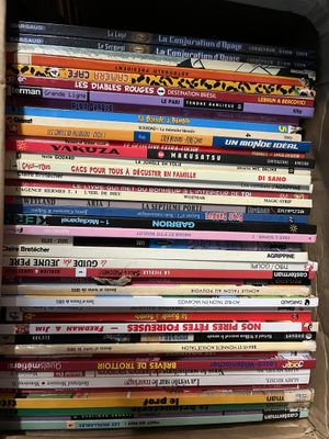 a lot of children ' s books stacked on a shelf
