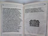 an open book with a picture of a plant on it