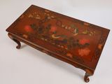 an image of a wooden table with flowers and birds painted on it