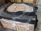 a box of bricks sitting on a pallet in a warehouse