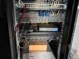 an image of a server rack with many wires in it