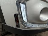 a close up of a car ' s bumper with a number plate on it