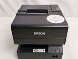 a close up of a printer sitting on top of a table