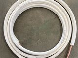 a close up of a white hose on a table