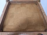 a chair made out of burlock fabric and a wooden frame