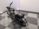 a motorcycle that is parked on a checkered floor