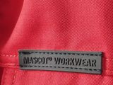 a close up of a label on a red jacket