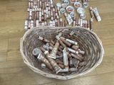 a basket full of cigars on the floor next to a basket of cigars