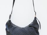 the bag is black and grey with a black handle and a black strap