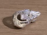 silver plated ring with a lizard on it ' s head