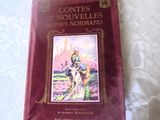 a red book with a picture of a man riding a horse