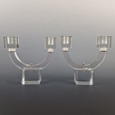 pair of clear glass candle holders with brass fittings