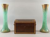 two vases sitting next to each other on a table