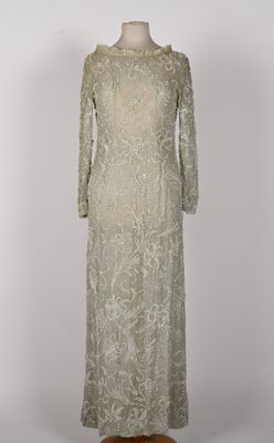 a white lace dress with long sleeves on a mannequin mannequin mannequin mannequin mannequin mannequin mannequin manne