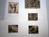 several drawings of people and animals are displayed on a white surface
