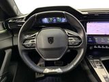 the interior of a car with a steering wheel, dashboard, and display screen