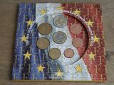 a picture of a picture of a book with coins on it