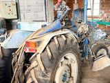 a tractor that is parked inside of a building