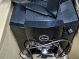 a black printer sitting in a box on the floor